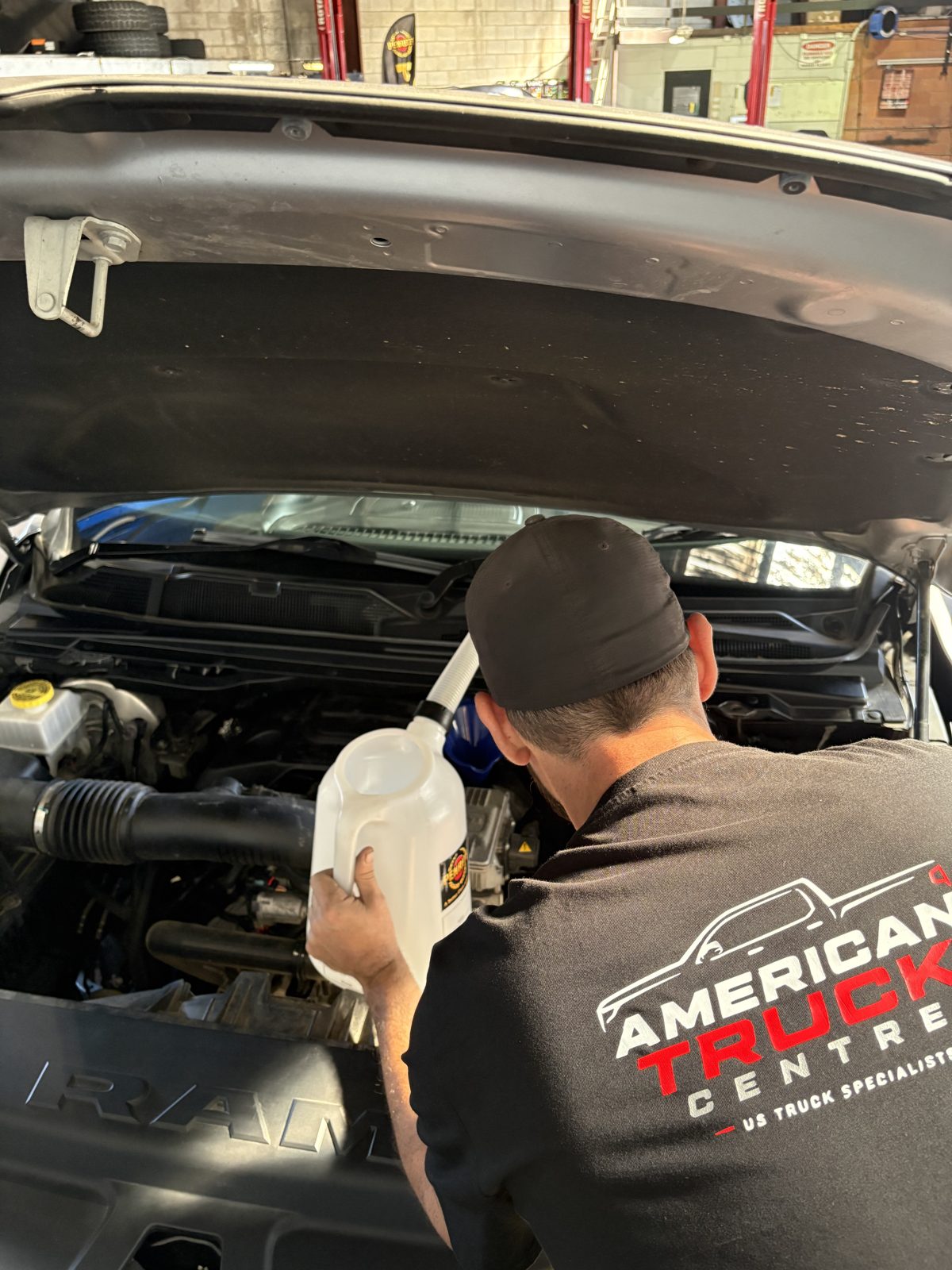 Penrite premium engine oil going into a RAM during a logbook service