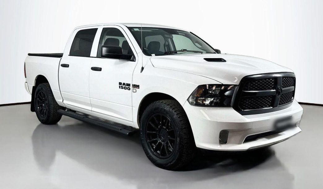 White RAM 1500 front three-quarter view