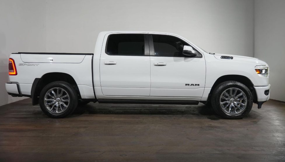 White RAM 1500 side profile outdoors