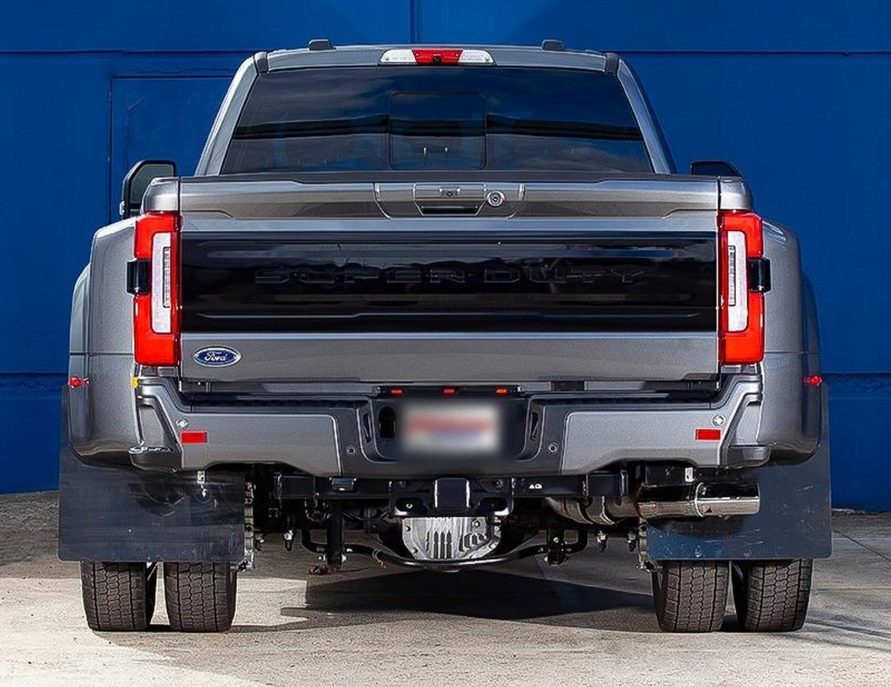 Rear of a grey RAM pickup with tow bar