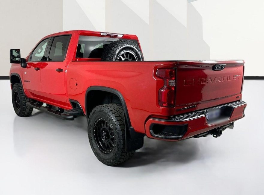 Red Chevrolet Silverado HD rear with tow hitch