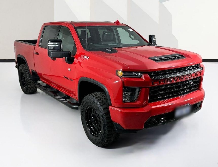 Red Chevrolet Silverado HD side profile
