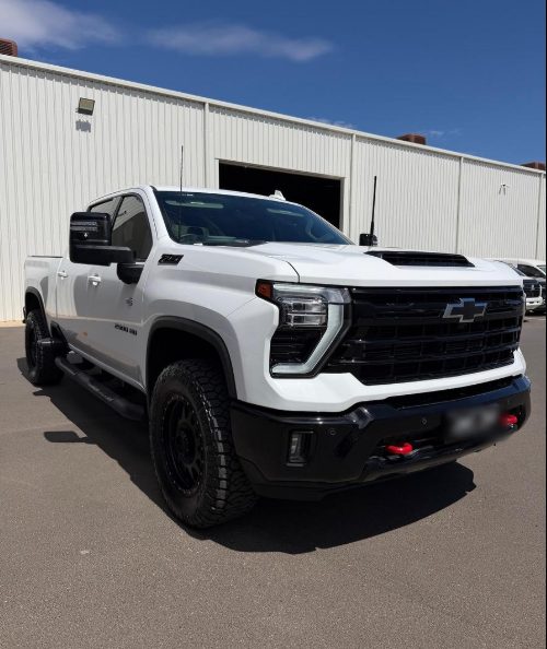 White Chevrolet Silverado HD parked outdoors